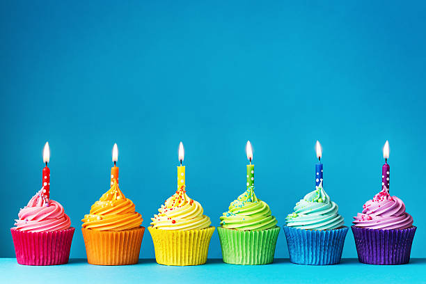 Birthday cupcakes Birthday cupcakes in rainbow colors number 6 photos stock pictures, royalty-free photos & images