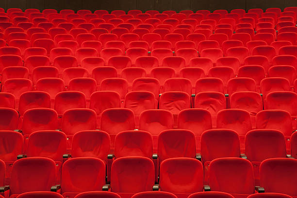 istock empty red cinema or theater seats 527887874