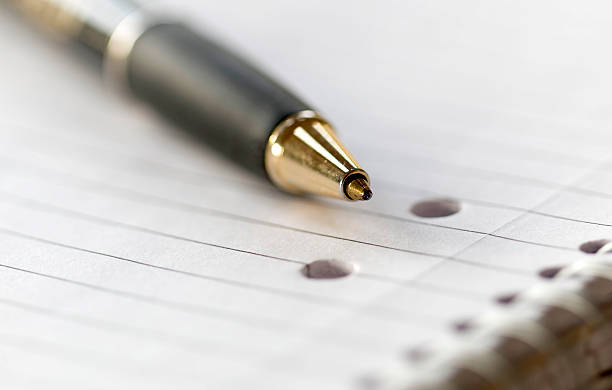 istock Closeup of a pencil on a writing pad 527889814