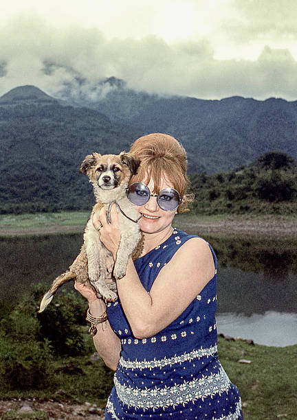 istock retro woman holding a dog 527891032