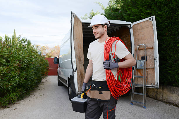 istock handsome young construction worker with commercial van on background 527891038