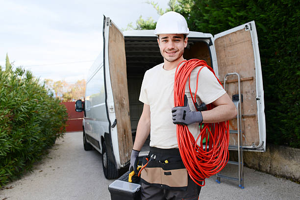 istock handsome young construction worker with commercial van on background 527891318