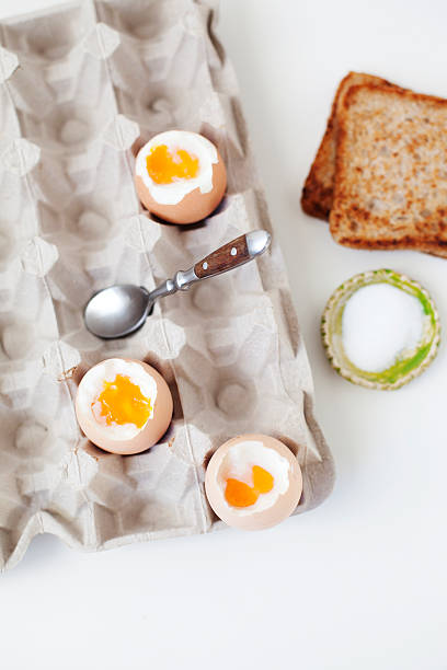 istock Fresh organic soft boiled eggs in carton served with toast. 527894926