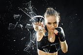 Women Fighter Punching Close Up Glass Shattering