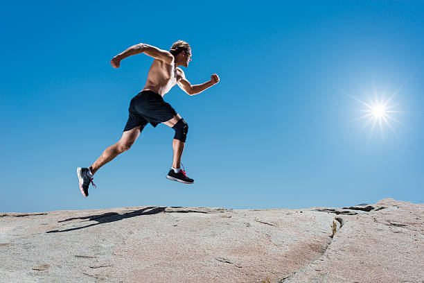 istock Male Running Up A Granite Boulder In The Mountains 527897506