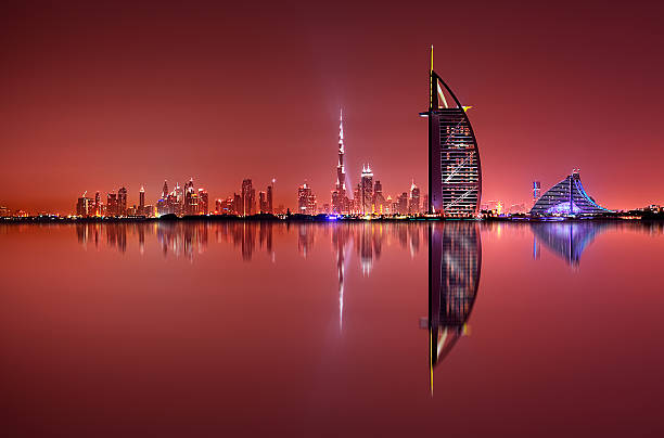 Dubai skyline reflection, Dubai, United Arab Emirates Dubai skyline reflection at amazing night, Dubai, United Arab Emirates dubai stock pictures, royalty-free photos & images