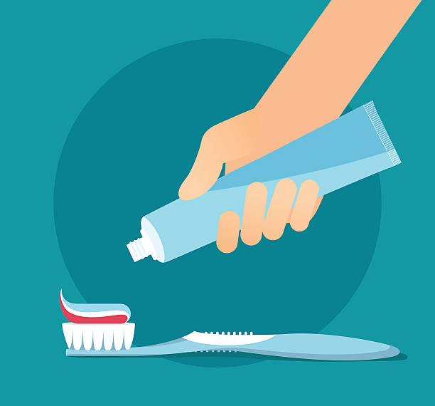 손 돌출 a) 치약 있는 튜브를 칫솔. - toothbrush stock illustrations