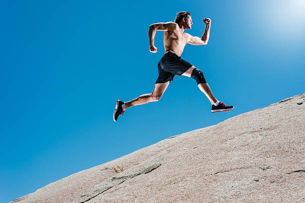 istock Male Running Up A Granite Boulder In The Mountains 527900738