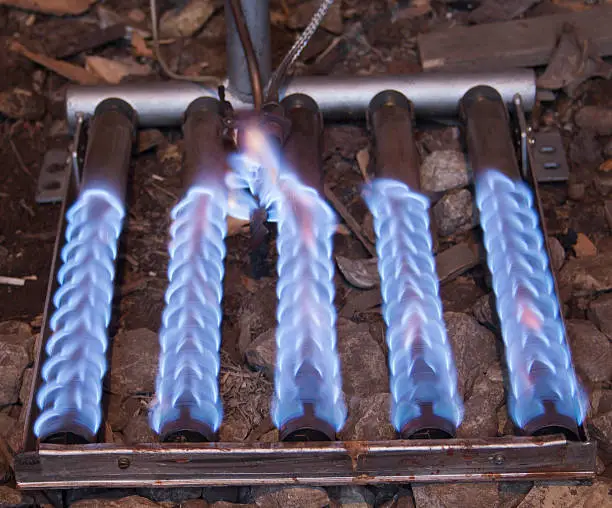 blue flame of a gas burner from boiler