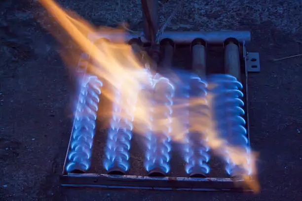 blue flame of a gas burner from boiler
