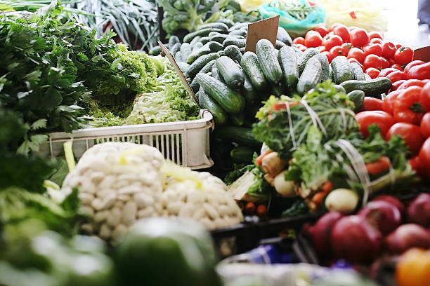 istock Vegetable stall - cucumbers, tomatoes, parsley. 527903226