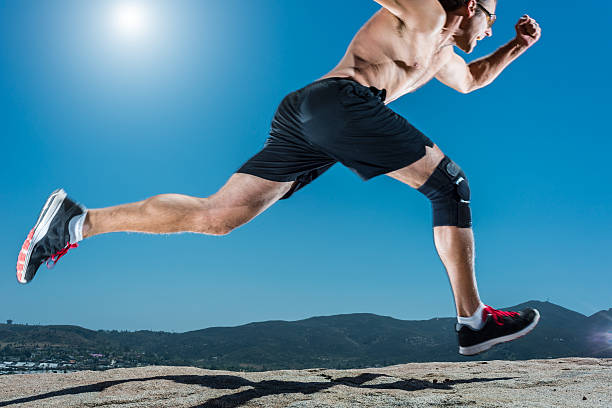 istock Knee Brace Running Up A Granite Boulder In The Mountains 527903618
