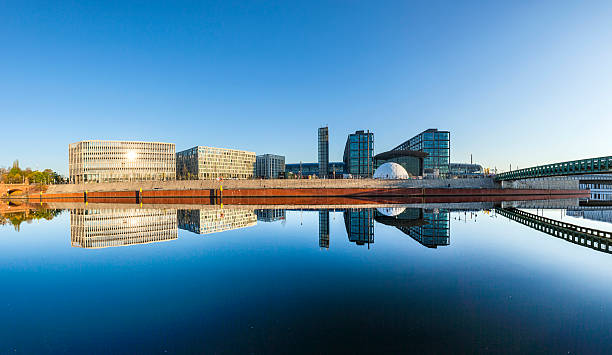 morning view of Central station with reflection from river Spree in Berlin, Germany