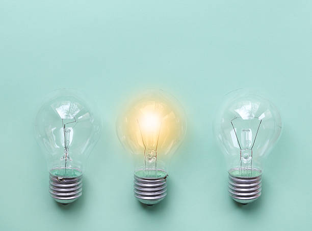 istock three glass bulbs for lamps - idea concept 527905854