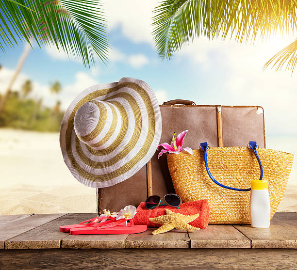 istock Suitcase and accessories for travelling on wood 527905886