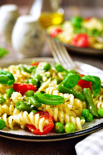 istock Pasta primavera on a vintage plates. 527906482