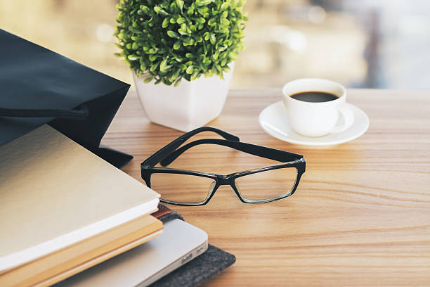 istock Desktop with glasses and plant 527906778