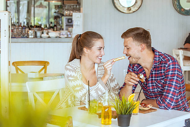 istock Young loving couple pleasantly chatting on a date in restaurant 527907532