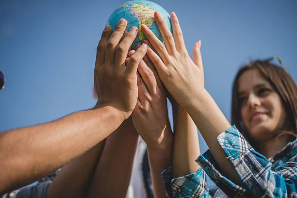istock Friends holding the world 527908000