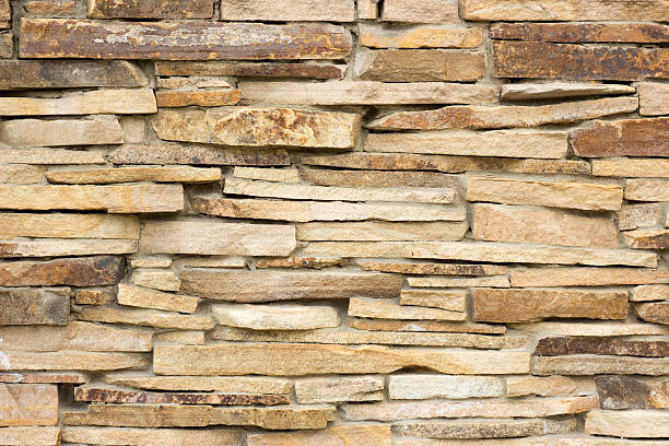 istock wall of a wild yellow decorative stone 527908396