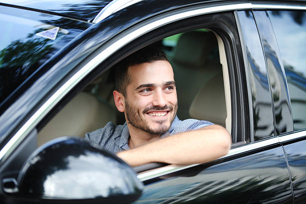 istock happy smiling driver in the car 527908514