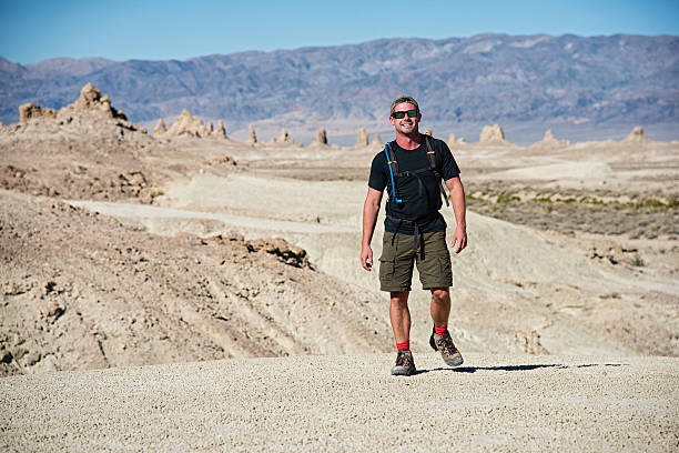 istock Smiling Man Hiking in the Mojave Desert 527910516