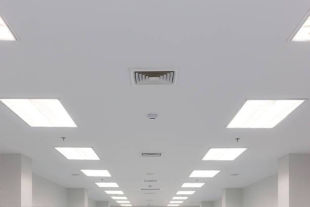 ceiling lighting and exhaust louver ceiling and fluorescent lighting with exhaust fan louver smoke detection and fire water sprinkler, selective focus fluorescent stock pictures, royalty-free photos & images