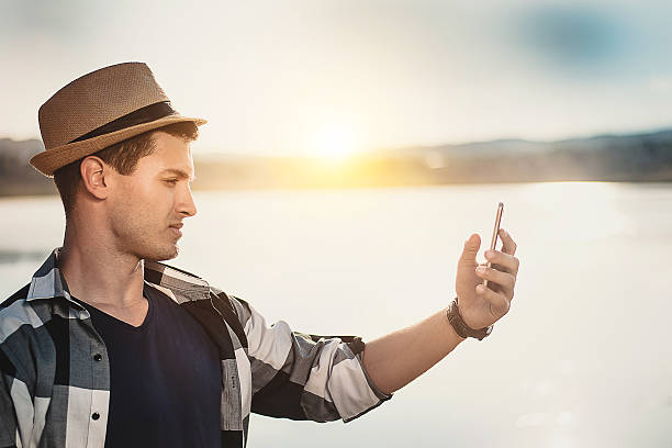 istock Young man with phone 527911134