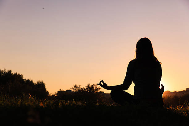 istock serenity and yoga practice at sunset 527911660