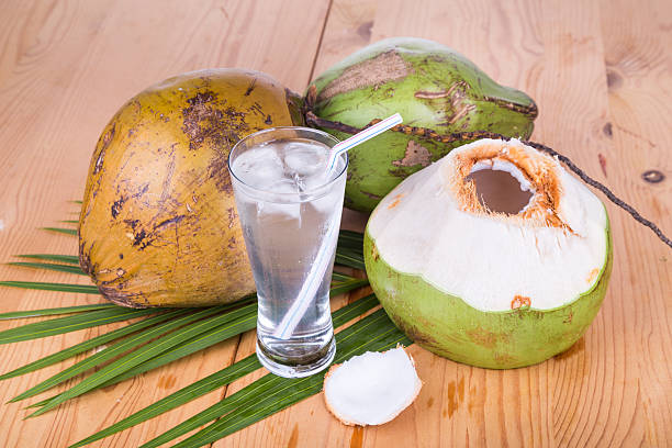 istock Three refreshing green coconut fruit juice in glass 527911952