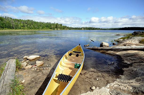 istock Canoe on the Shore of Wilderness Lake 527913038