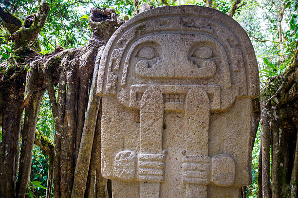 Statue in the rainforest - San Agustin, Colombia stock photo