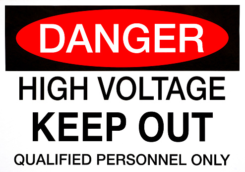 A Danger, High Voltage safety sign in bold lettering.