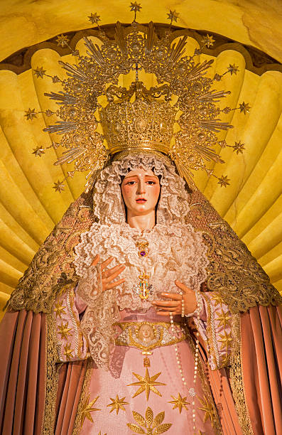 Seville - The cried and typically vested Virgin Mary statue on the main altar in church Iglesia de Santa Maria de los Angeles.