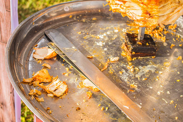 istock Grilled chicken pieces and a knife 527954689