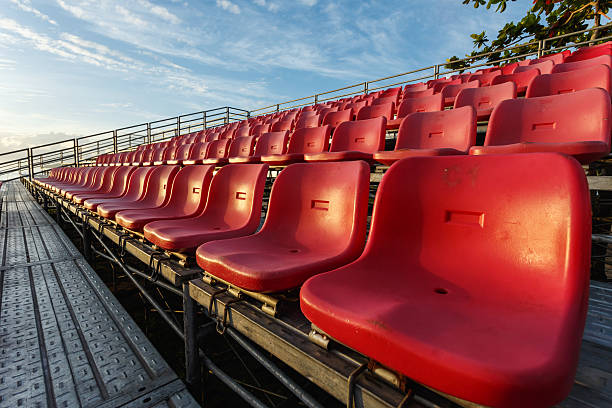 istock Empty plastic chairs at temporary grandstand stadium in Phuket, 527957681