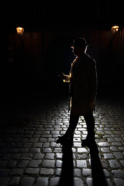 vintage gangster with fedora and a gun