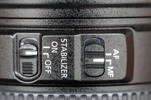 Close up stabilizer button on lens