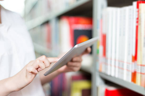 istock young beautiful asian girl university student in library 528042284