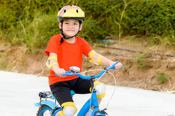 istock Portrait smart Asian kid are riding bicycle 528045808