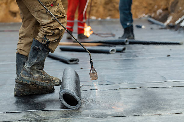 istock worker waterproofing of the building foundation 528046488