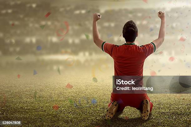 Winning Football Player Stock Photo - Download Image Now - Soccer, Scoring a Goal, Celebration