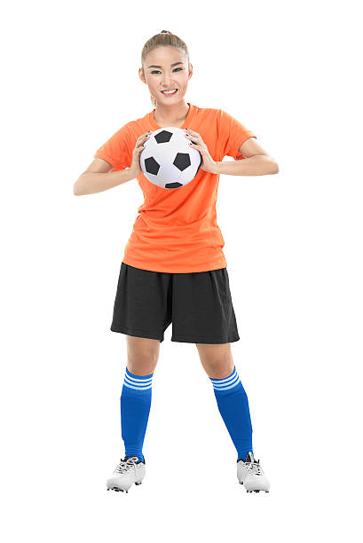 istock Woman holding soccer ball 528048102