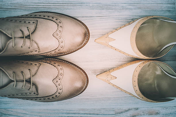 Couple's wedding shoes on hardwood stock photo