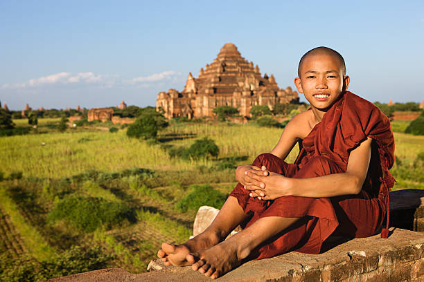 istock Young Buddhist monk looking at the Bagan's panorama 528054548