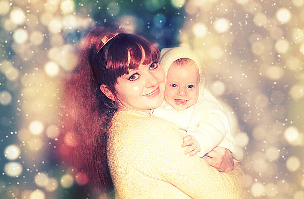 istock Happy mommy holding her happy baby 528054844