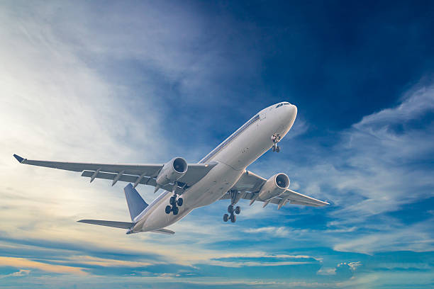 istock Commercial airplane flying with blue sky background 528057626