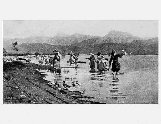 istock Washerwomen Of Torre At The Lake by E. Cecconi 528058568