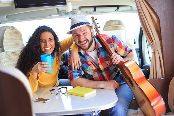 istock Young couple having fun inside of a caravan 528059276
