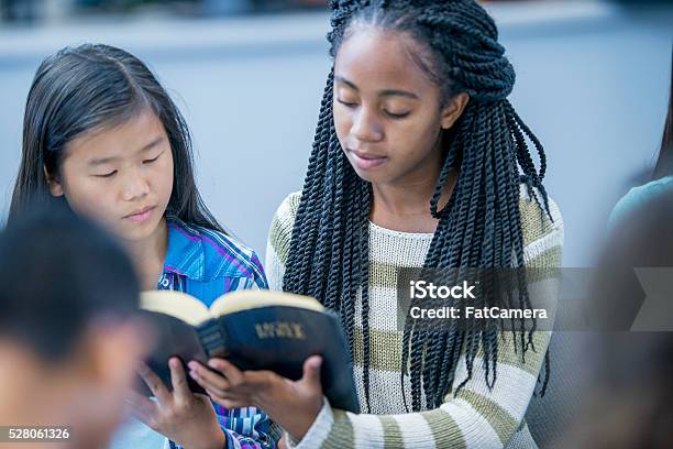 Reading The Bible Together Stock Photo - Download Image Now - Bible, Teenager, Church